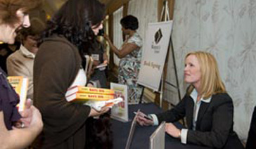 Author-Elisabeth Leamy-Signs Save BIG for a fan at CCCS of Dallas Event