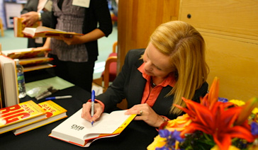 Author-Elisabeth Leamy-signs Save BIG for fans at the New Jersey Financial Literacy Summit